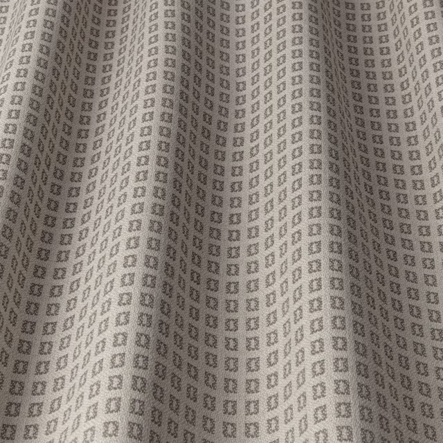 Warm taupe woven fabric with a small square geometric repeat