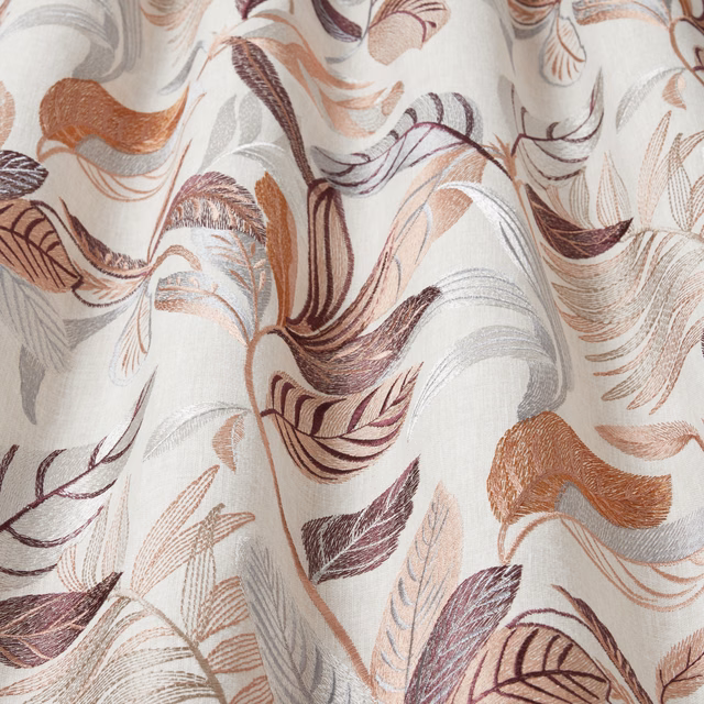 Cream fabric with sweeping rosedust, plum and terracotta wavy leaf motifs