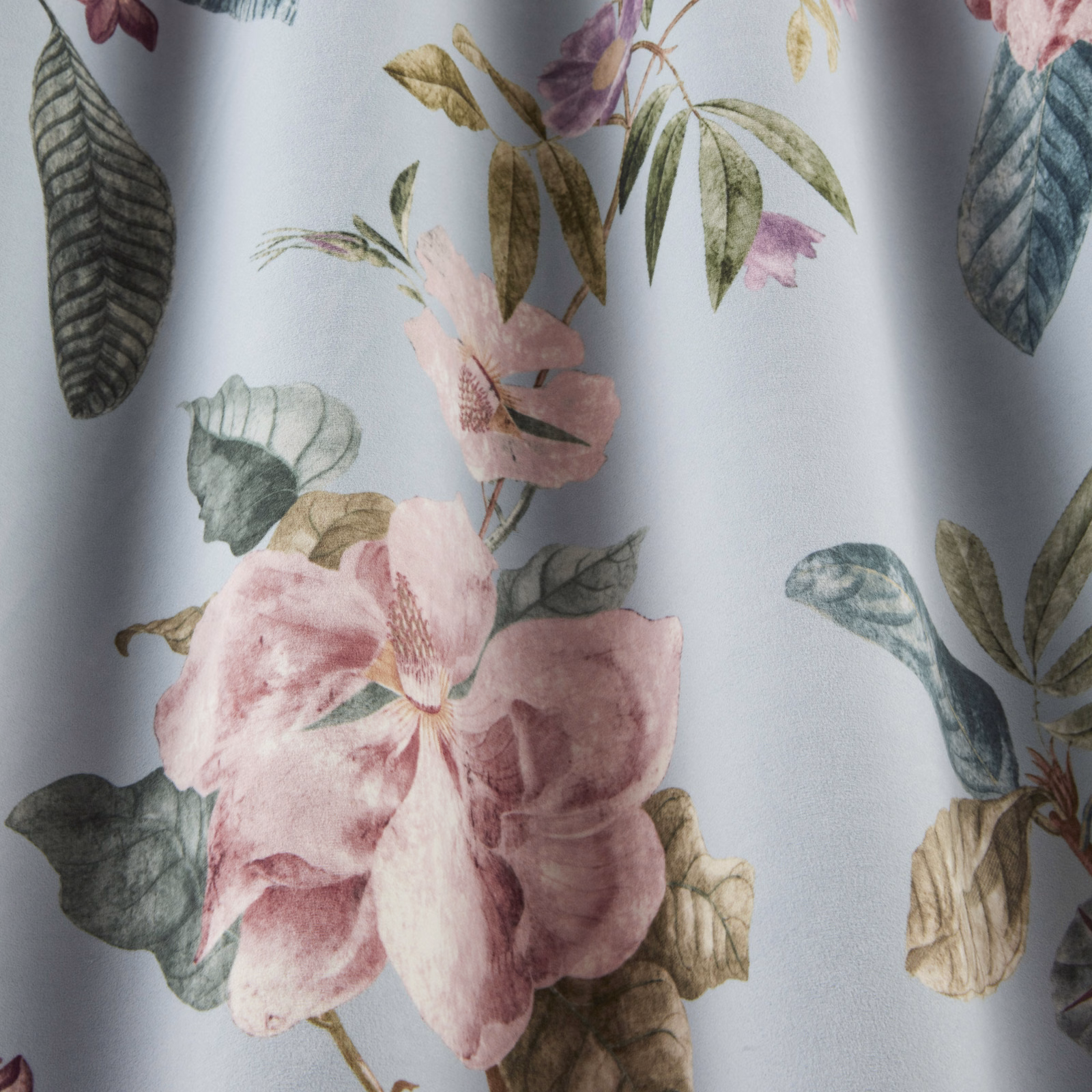 Soft sky-blue botanical fabric with large pink flowers and muted green leaves