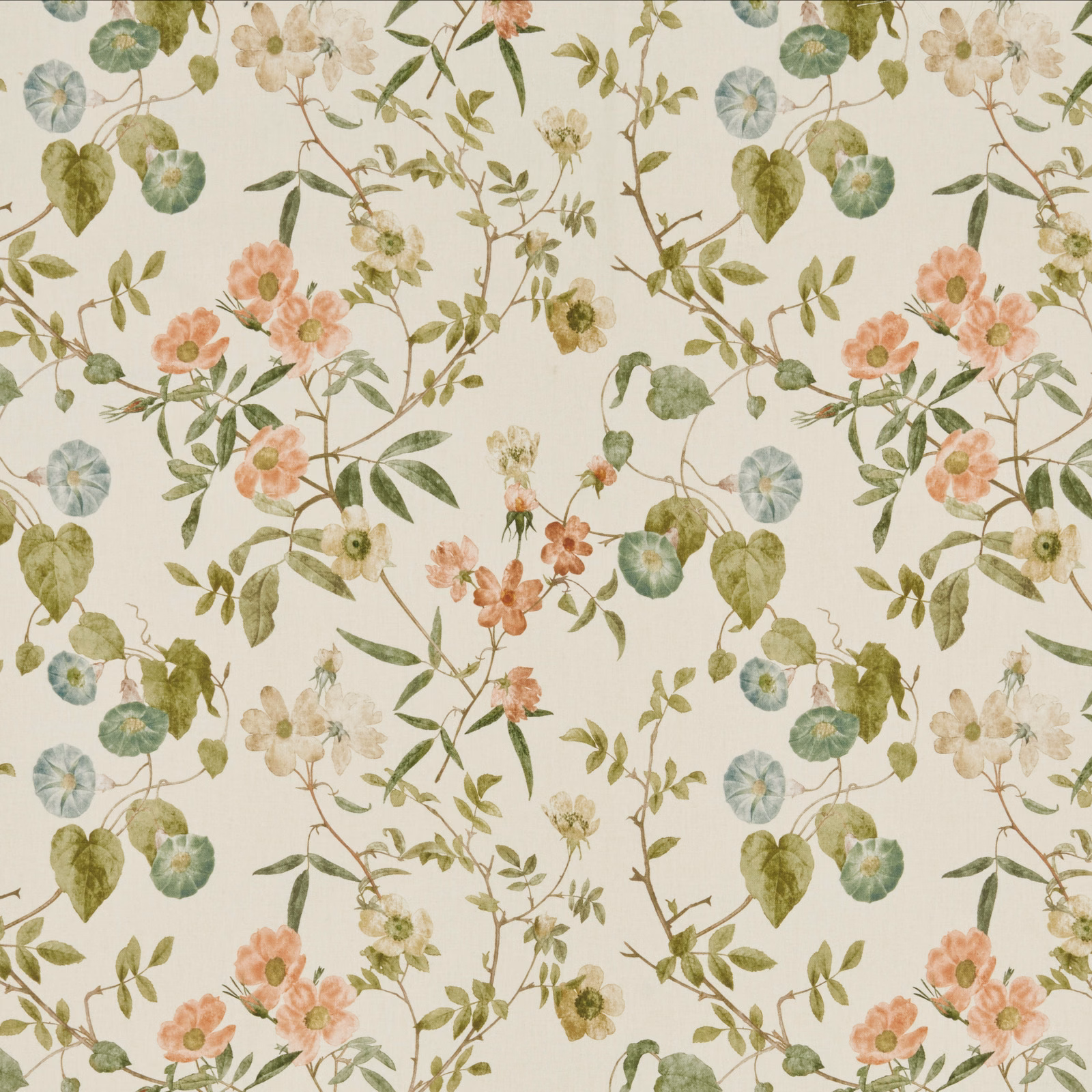 Painterly floral fabric on a warm cream ground with papaya pink and green leaves