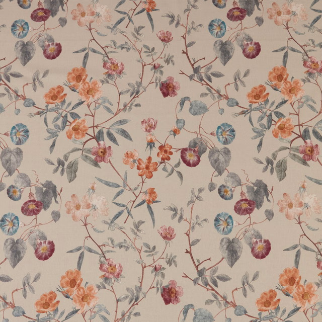 Painterly floral fabric on warm parchment ground with grey-blue leaves and coral blooms