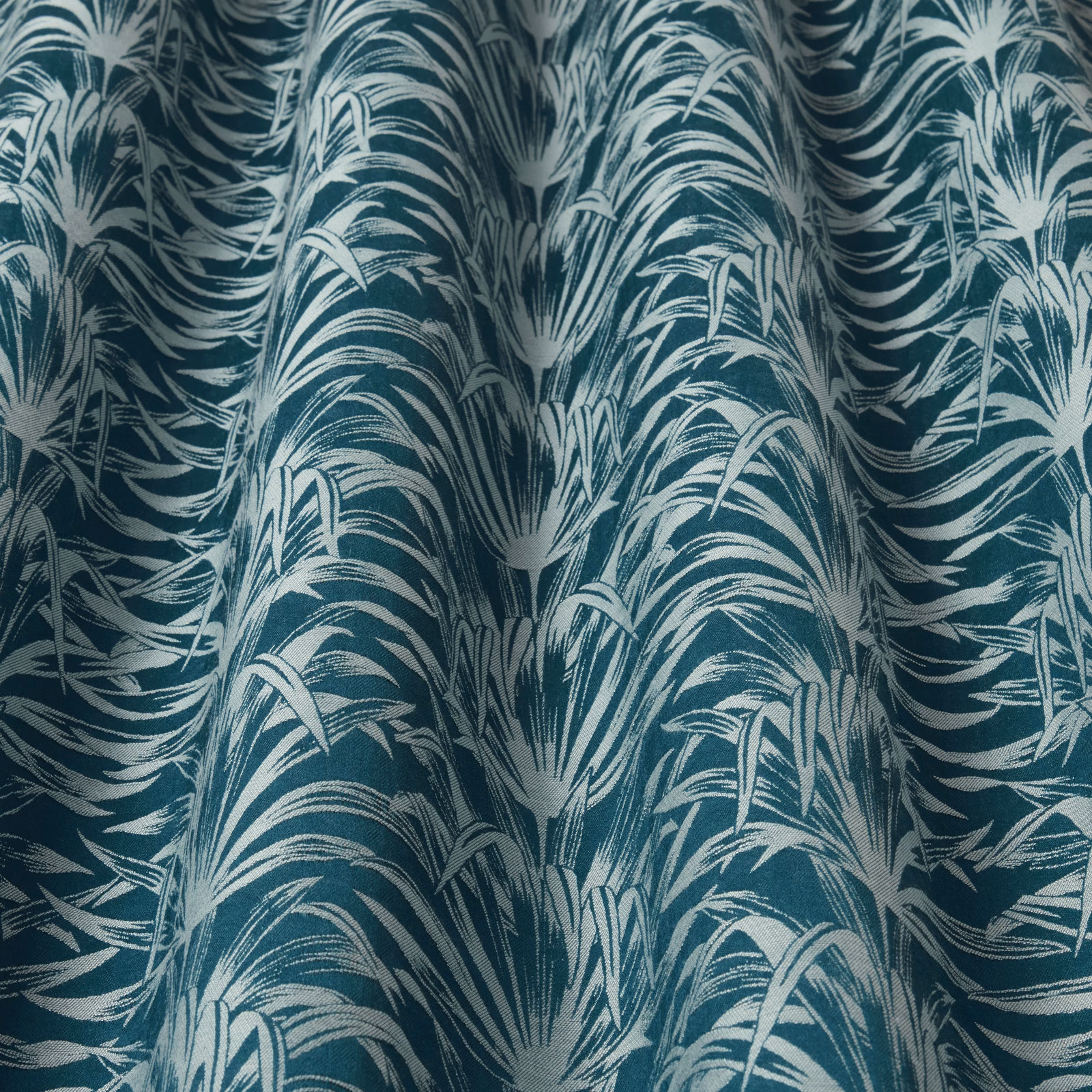 Teal and ivory botanical weave with large flowing leaf pattern