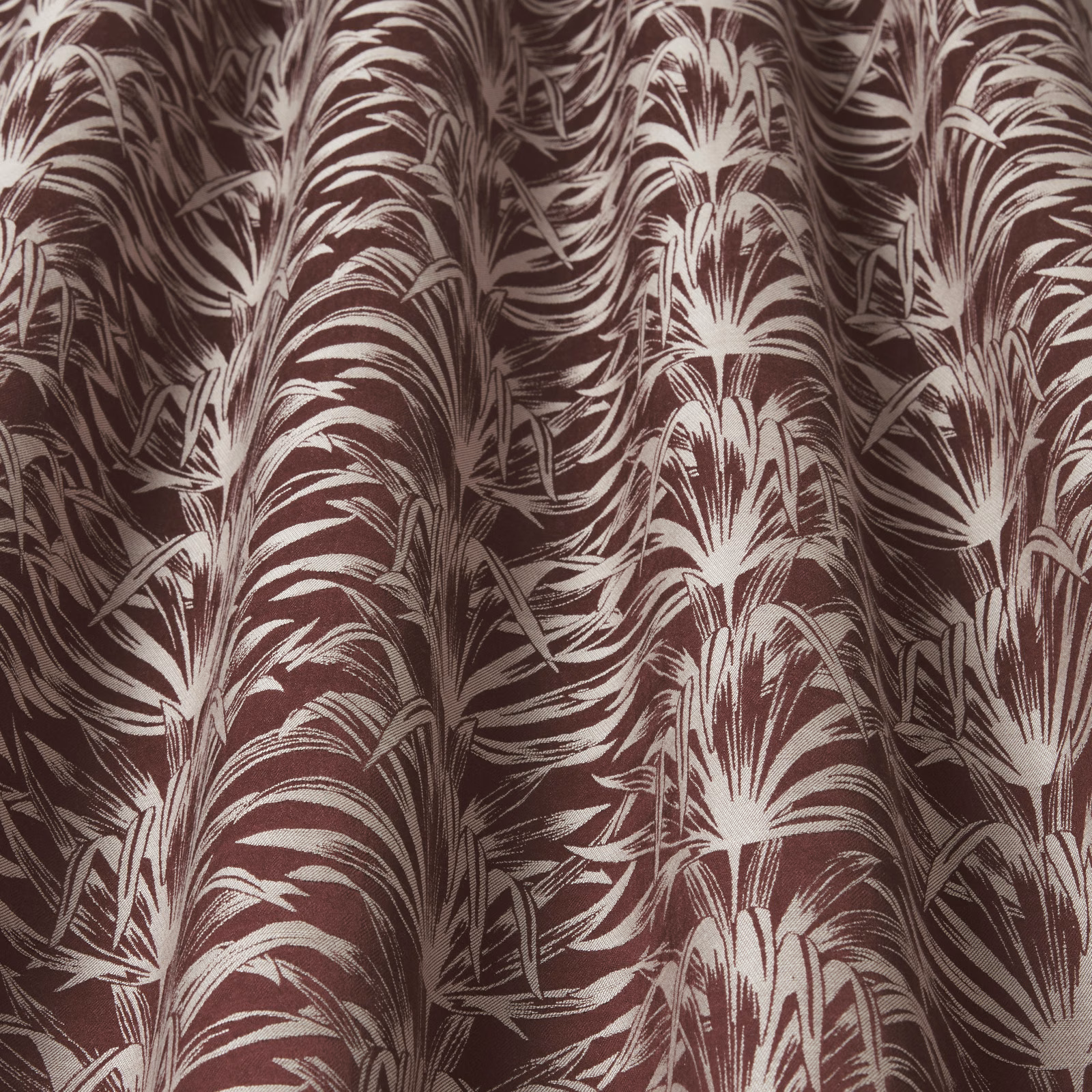 Damson and ivory wavy botanical print fabric with a glossy woven look