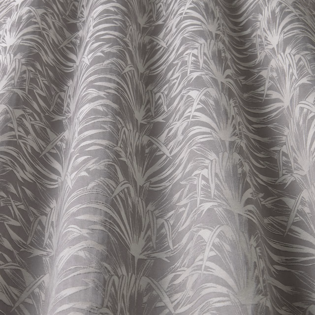 Grey leaf-wave patterned fabric with a soft satin sheen and flowing repeat