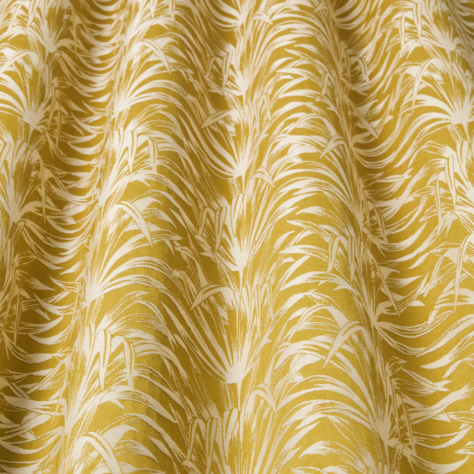 Mustard gold and ivory wavy botanical fabric with a large flowing repeat