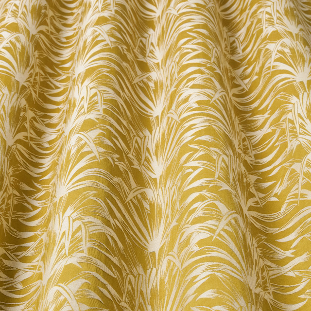Mustard gold and ivory wavy botanical fabric with a large flowing repeat
