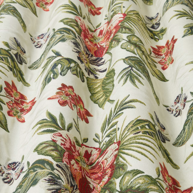 Cream botanical fabric with green leaves and red tropical flowers