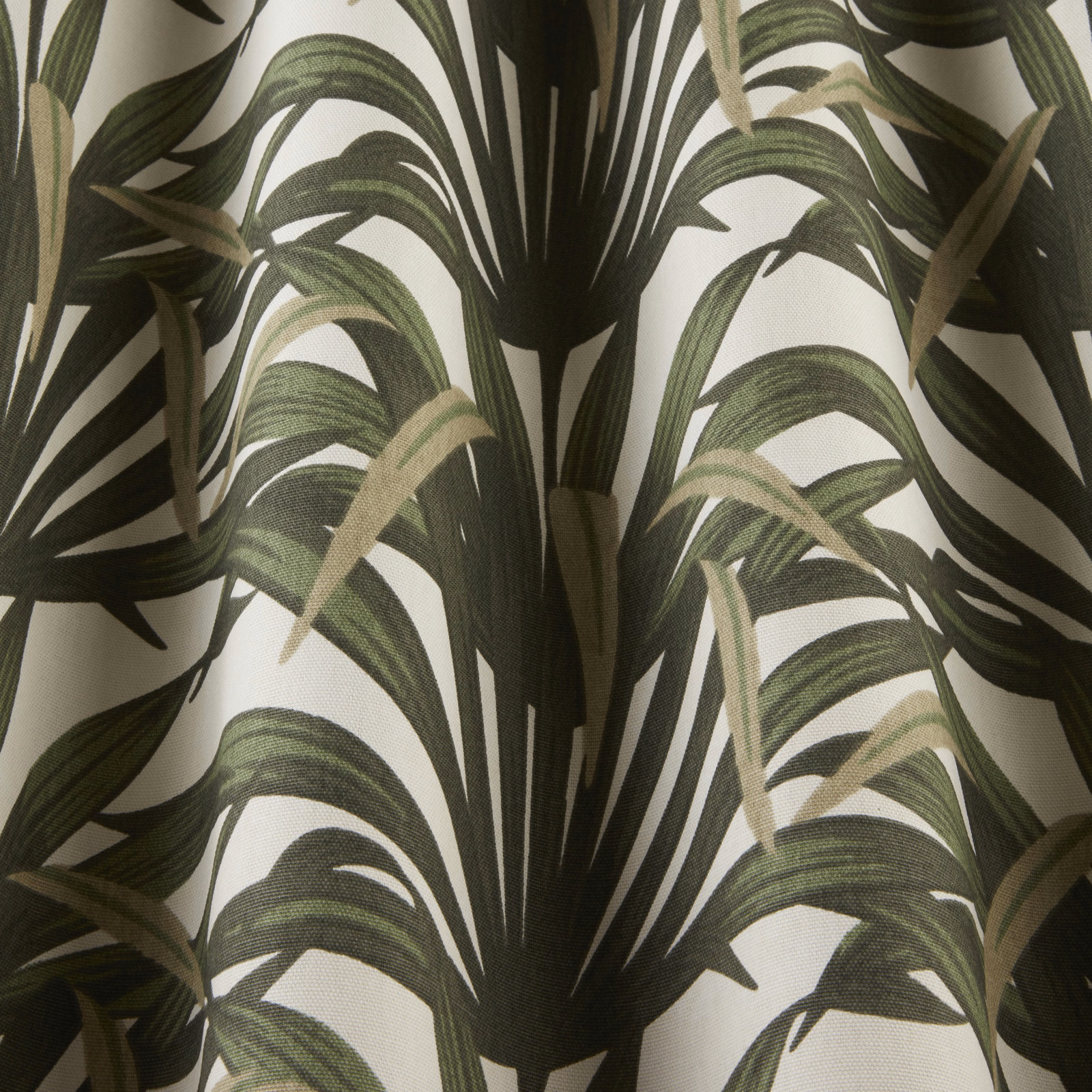 Large palm-leaf print in dark and moss green on a cream ground
