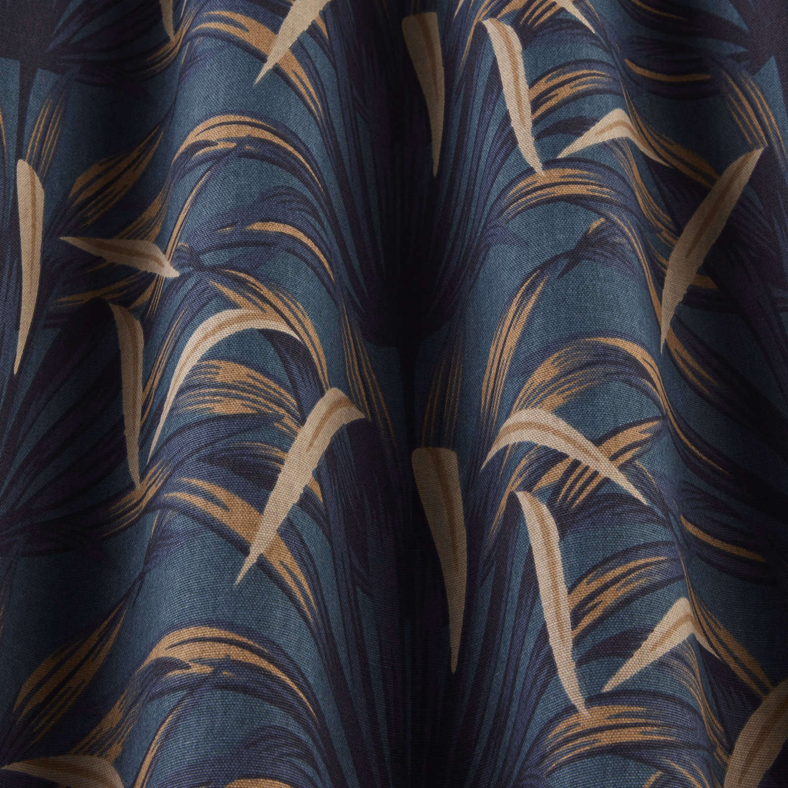 Deep teal fabric with sweeping beige leaf-like waves and dark striping