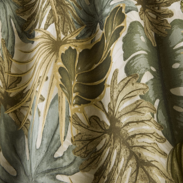 Botanical leaf print in misty green and olive on a pale ground