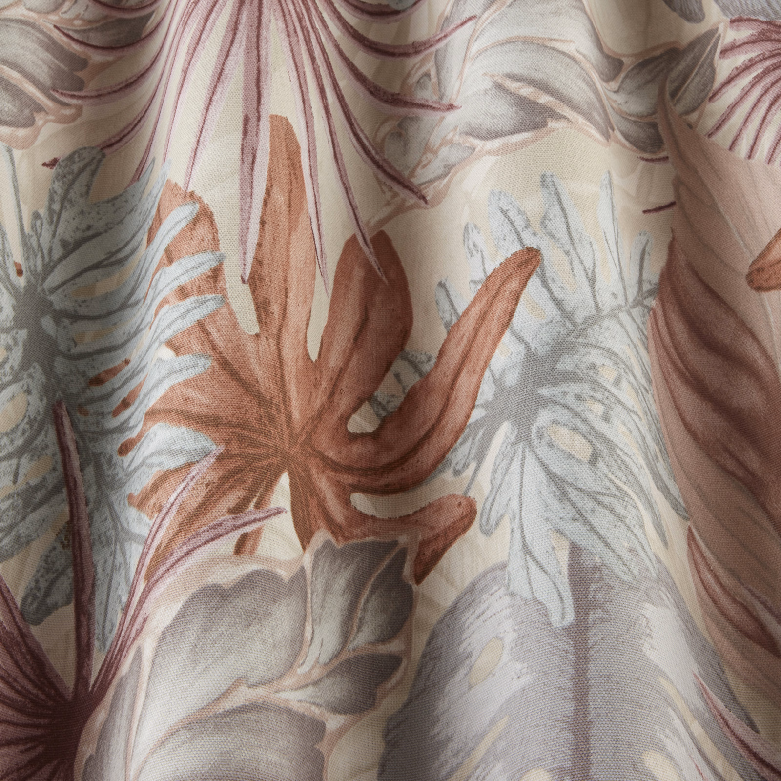 Pale botanical fabric with dusty rose leaves and misty grey-green foliage
