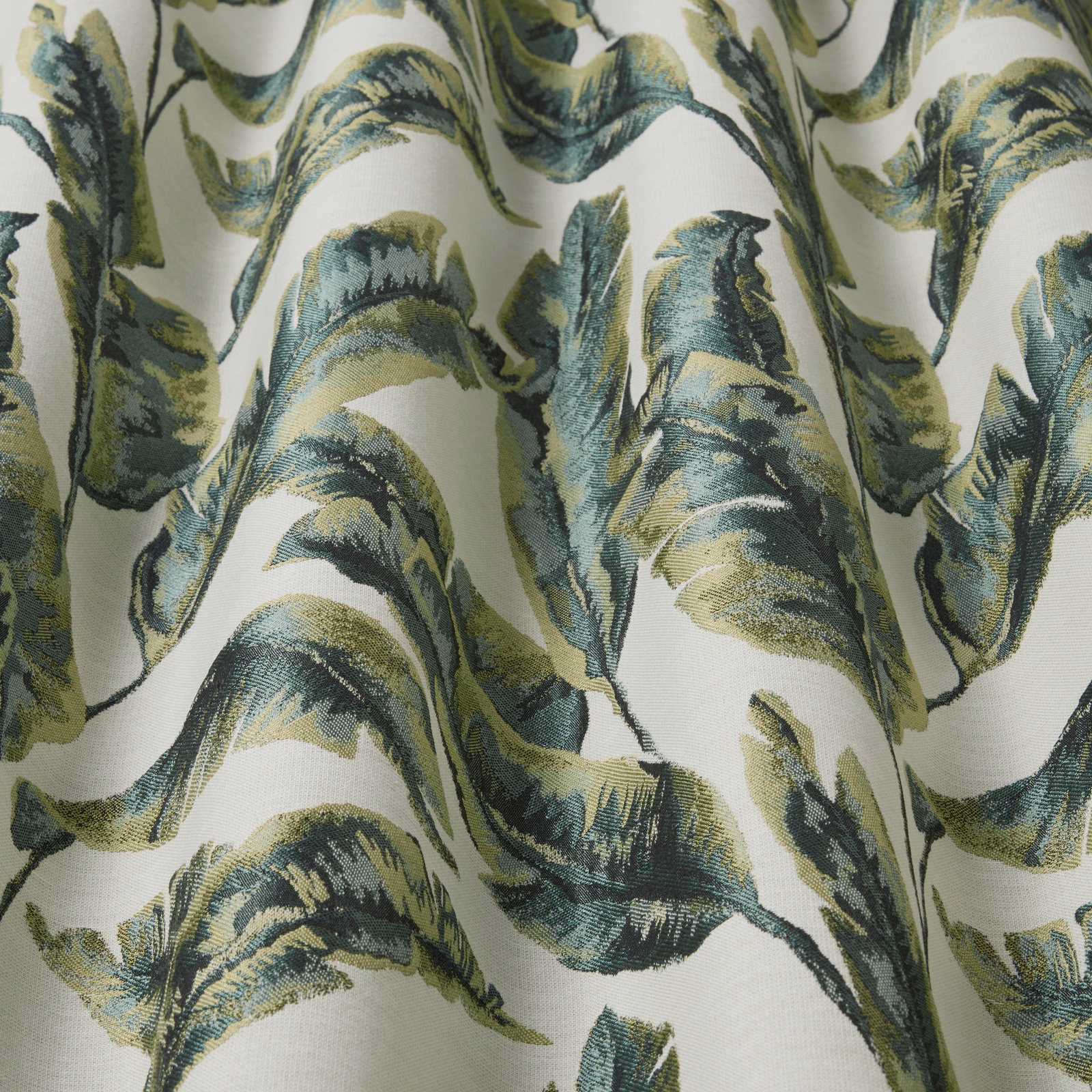 Large leafy botanical print in forest green, teal and olive on ivory fabric