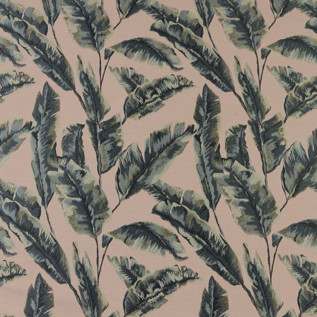 Blush pink fabric with large painterly green palm leaves and soft woven texture