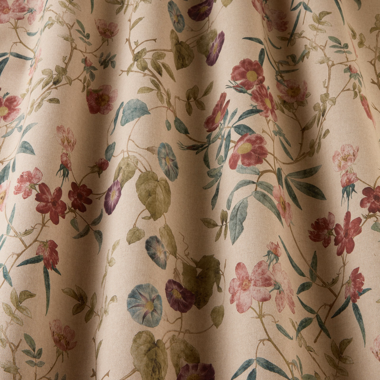 Cream floral fabric with damson, pink and blue-green trailing blossoms