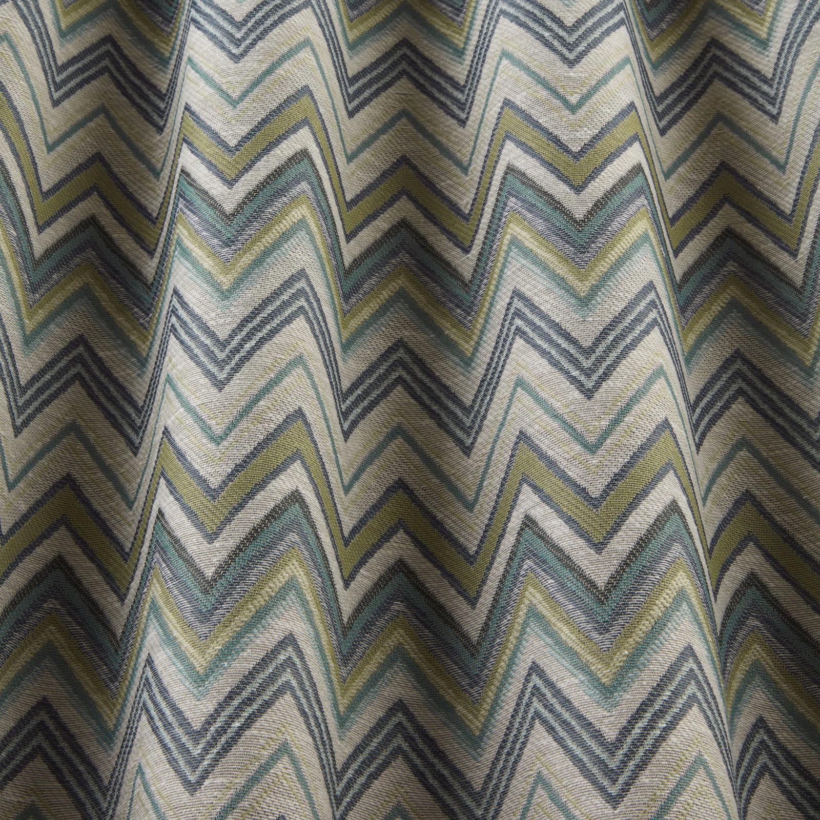 Pale zigzag woven fabric in sage, teal, grey and yellow bands