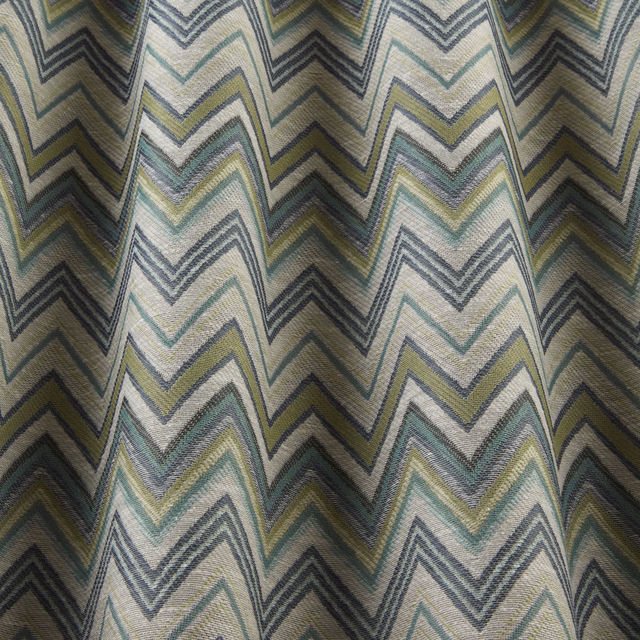 Pale zigzag woven fabric in sage, teal, grey and yellow bands