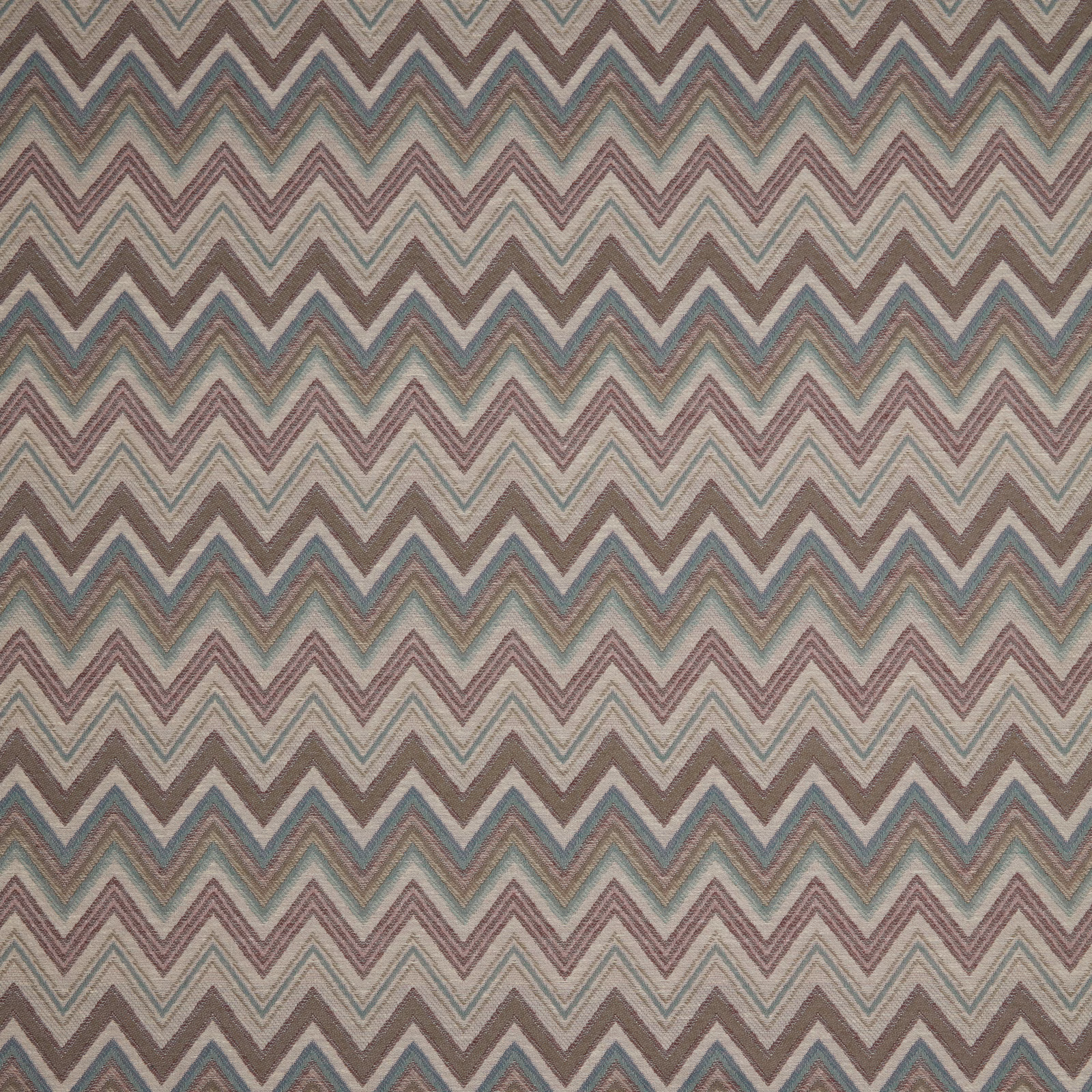 Damson, teal and taupe chevron woven fabric on a cream ground