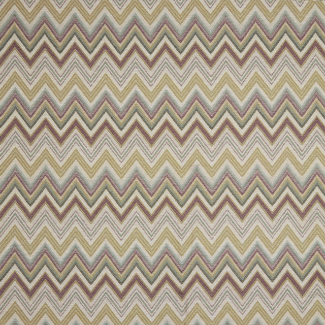 Soft zigzag fabric in moss, lilac and taupe on an ivory ground