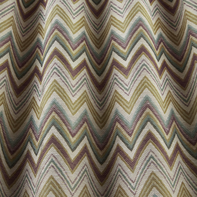 Woven chevron fabric in sage, lilac, ochre and taupe zigzags