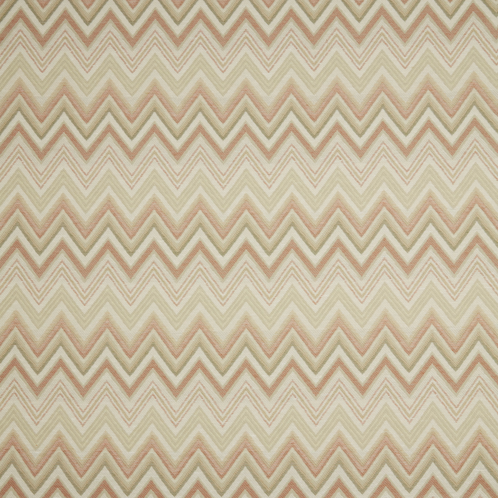 Soft papaya and cream zigzag fabric with a blurred woven texture