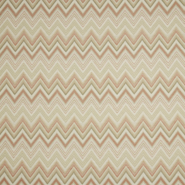 Soft papaya and cream zigzag fabric with a blurred woven texture