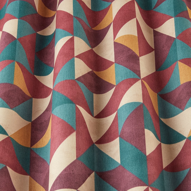Geometric wavy fabric in bilberry, teal, cream and ochre folds