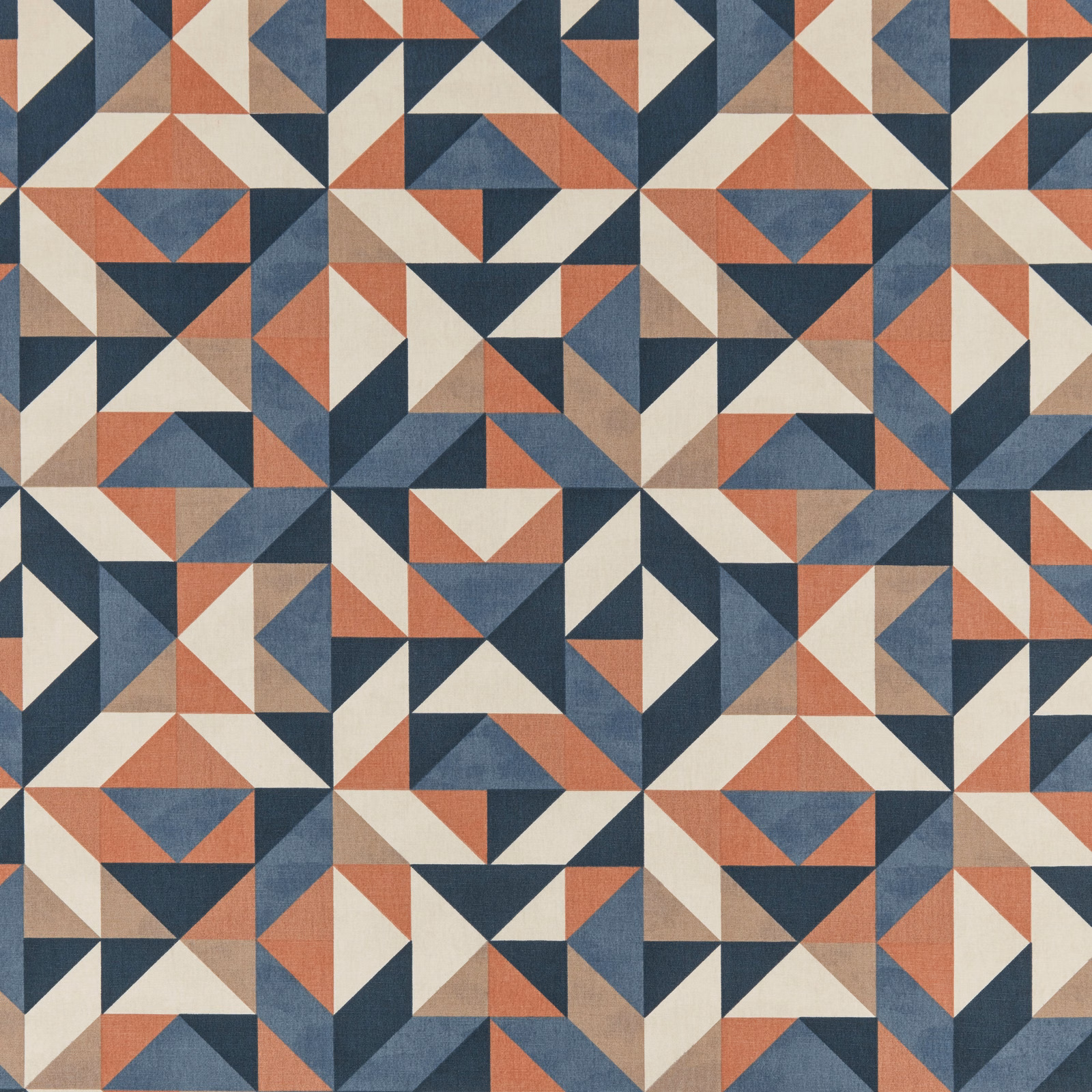 Geometric fabric swatch in navy, terracotta, cream and taupe triangles