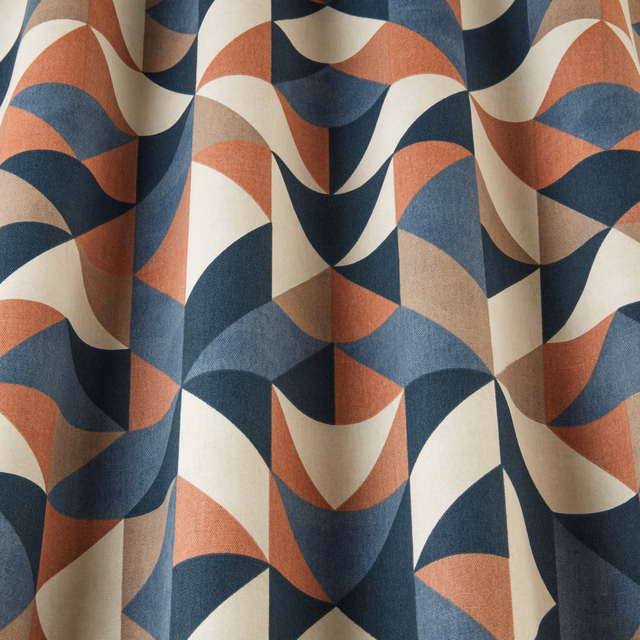 Geometric wavy fabric in navy, terracotta, cream and taupe folds
