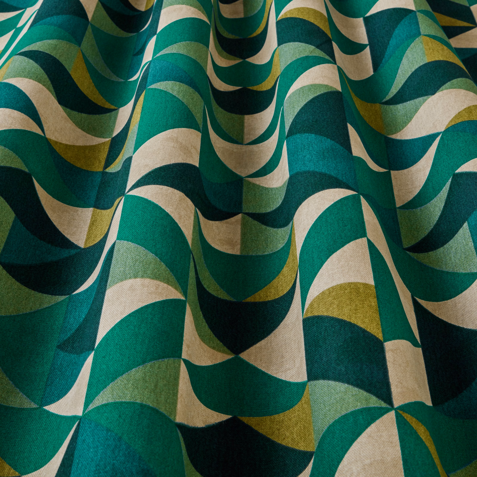 Close-up of jade, teal and cream wavy geometric upholstery fabric