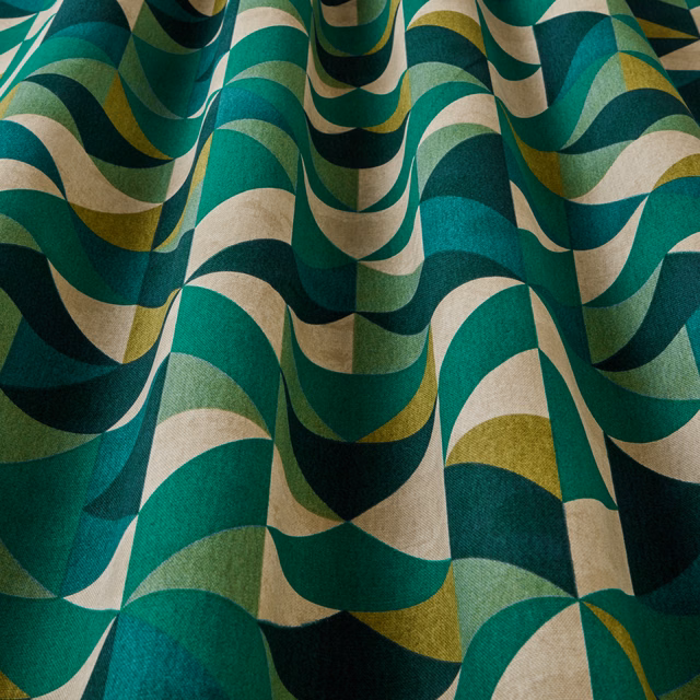 Close-up of jade, teal and cream wavy geometric upholstery fabric