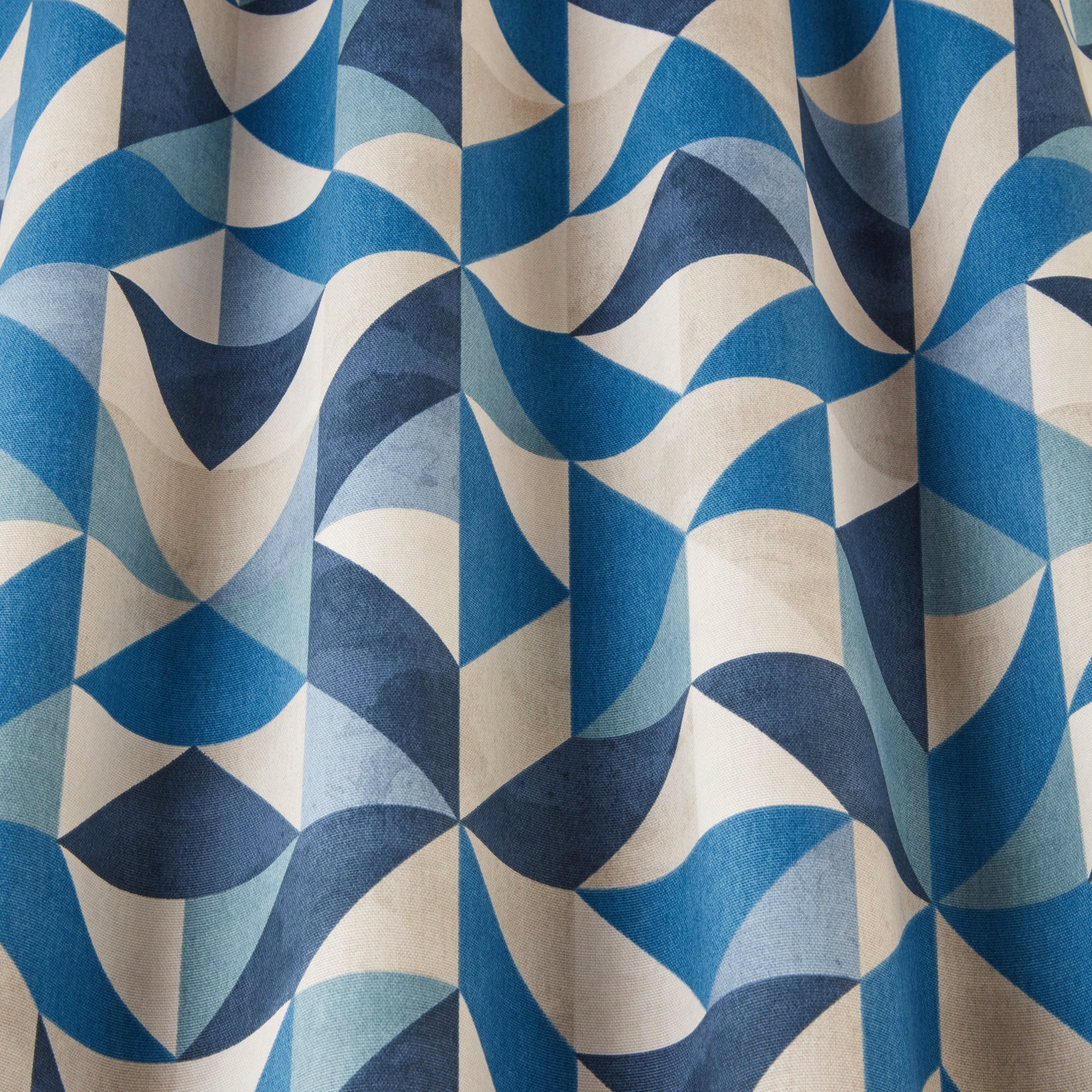 Blue and cream geometric wave fabric with large folded arcs and angular repeats