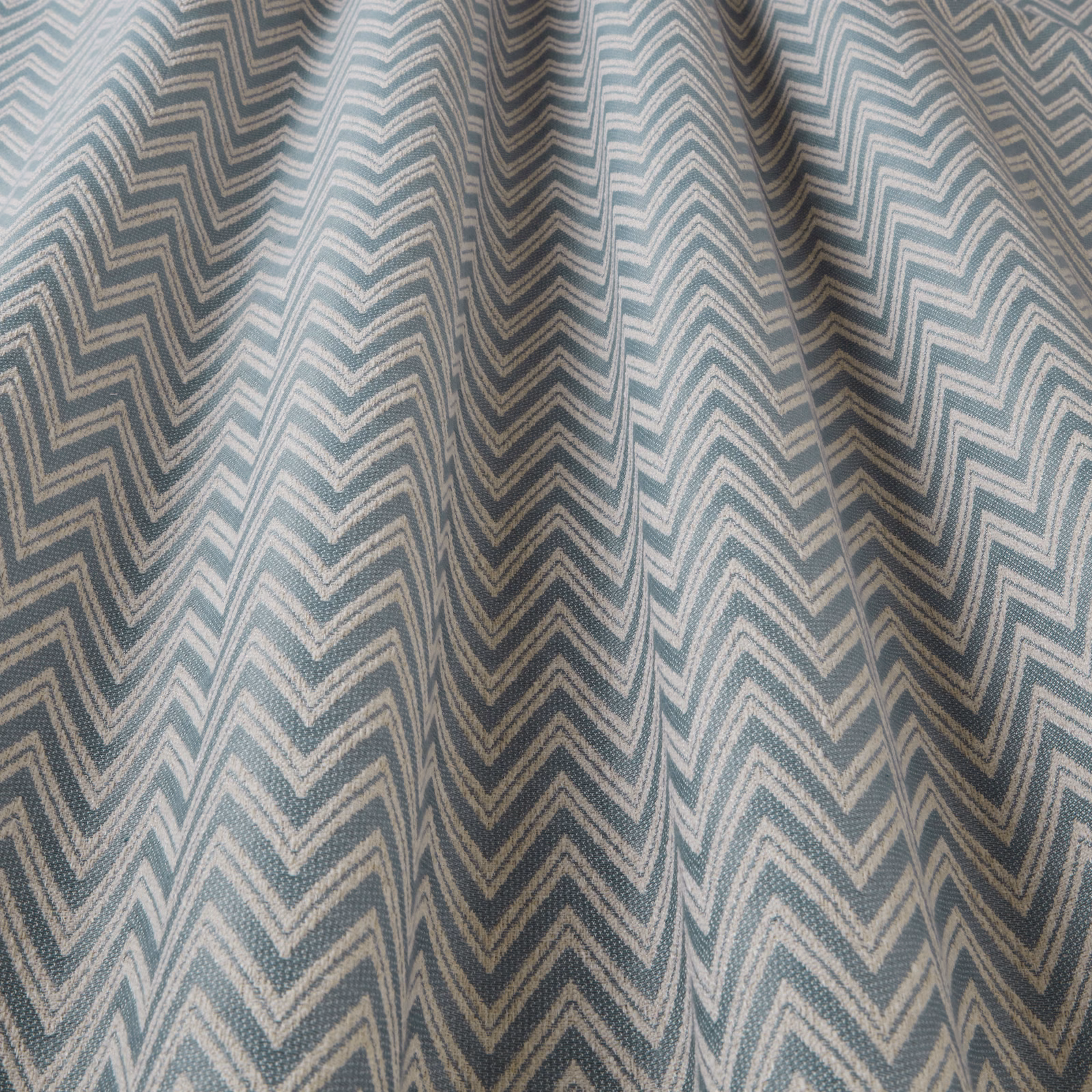 Soft eau de nil chevron fabric with pale ivory zigzag stripes and woven texture