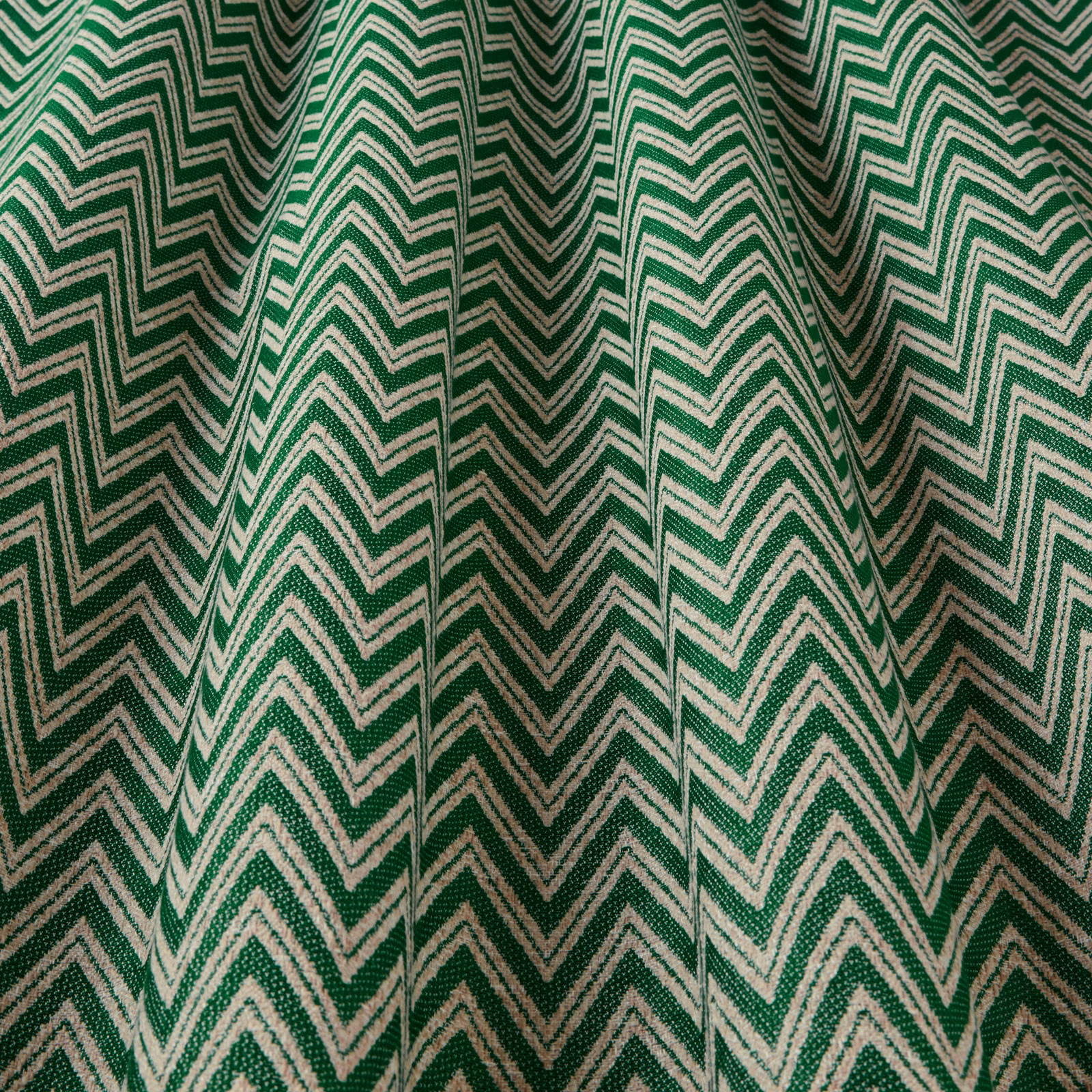 Green and ivory zigzag woven fabric with textured chevron stripes