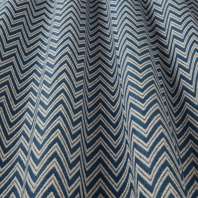 Teal blue and ivory zigzag woven fabric with a large chevron pattern