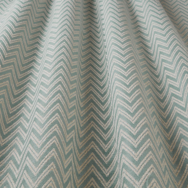 Seafoam teal woven fabric with large ivory zigzag chevron pattern