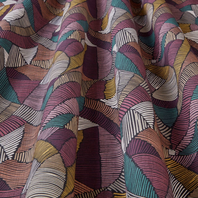Colourful wavy geometric fabric in bilberry, teal, gold and blush tones