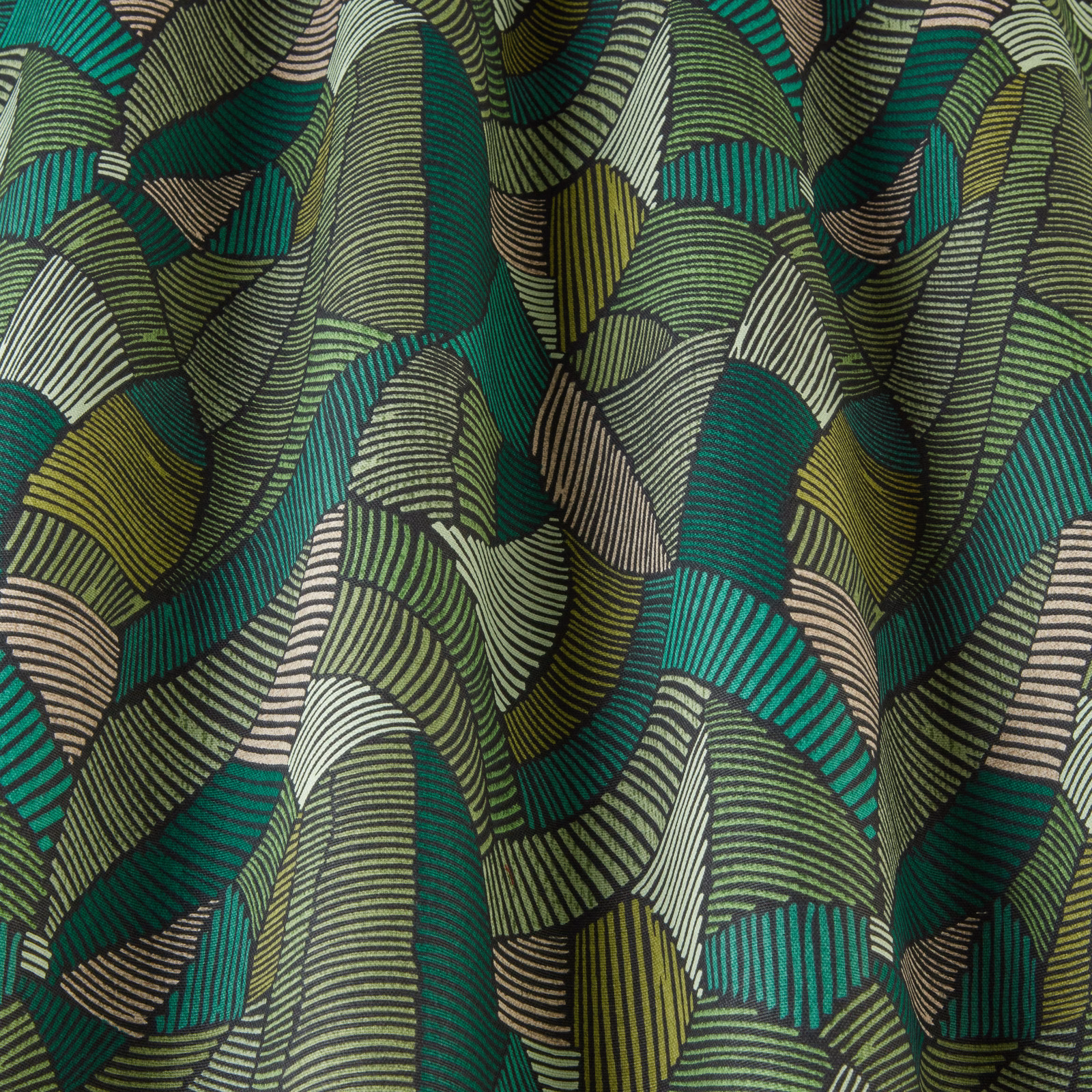 Bold green geometric fabric with wavy striped arcs in jade, teal and olive