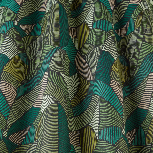 Bold green geometric fabric with wavy striped arcs in jade, teal and olive