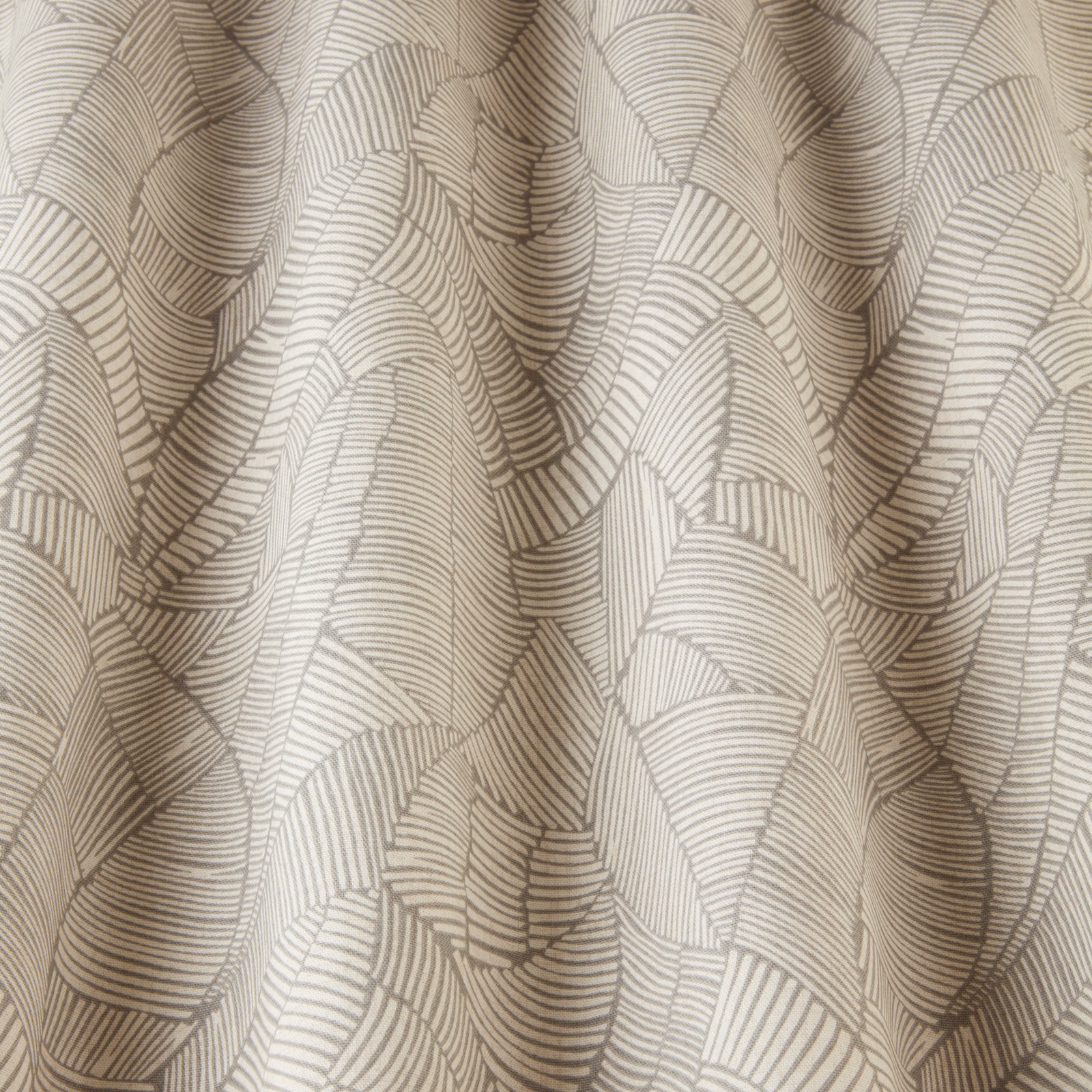 Cream geometric fabric with wavy taupe line pattern and soft woven texture