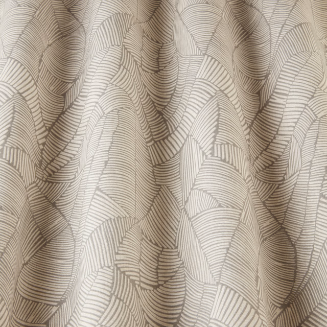 Cream geometric fabric with wavy taupe line pattern and soft woven texture
