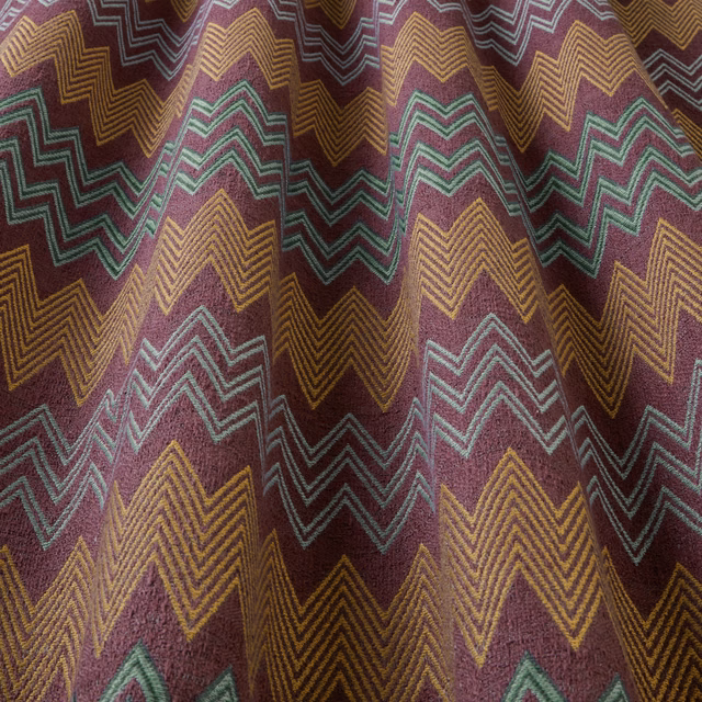 Deep bilberry fabric with zigzag teal and gold geometric stripes