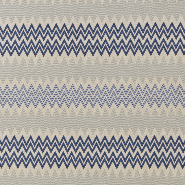Blue zigzag geometric fabric on a pale stone ground with layered stripes