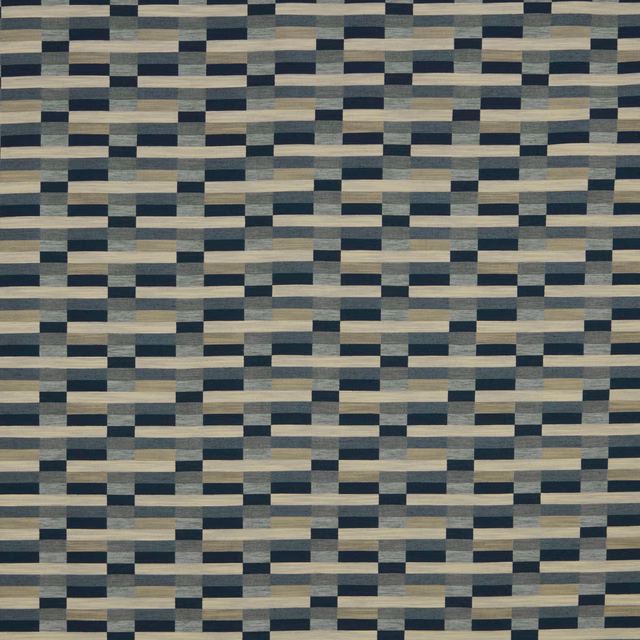 Close-up of a navy, grey and sand geometric woven fabric swatch