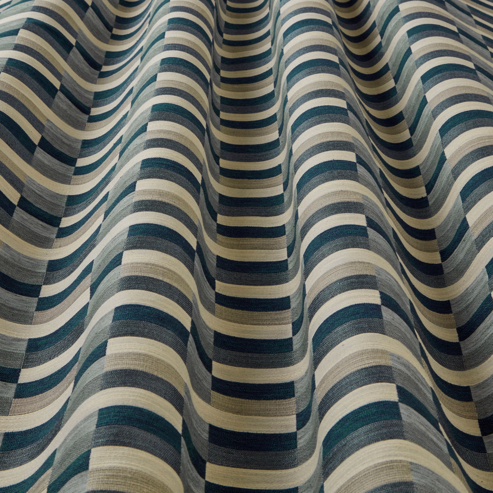 Teal, cream and slate wavy striped woven fabric with a textured finish