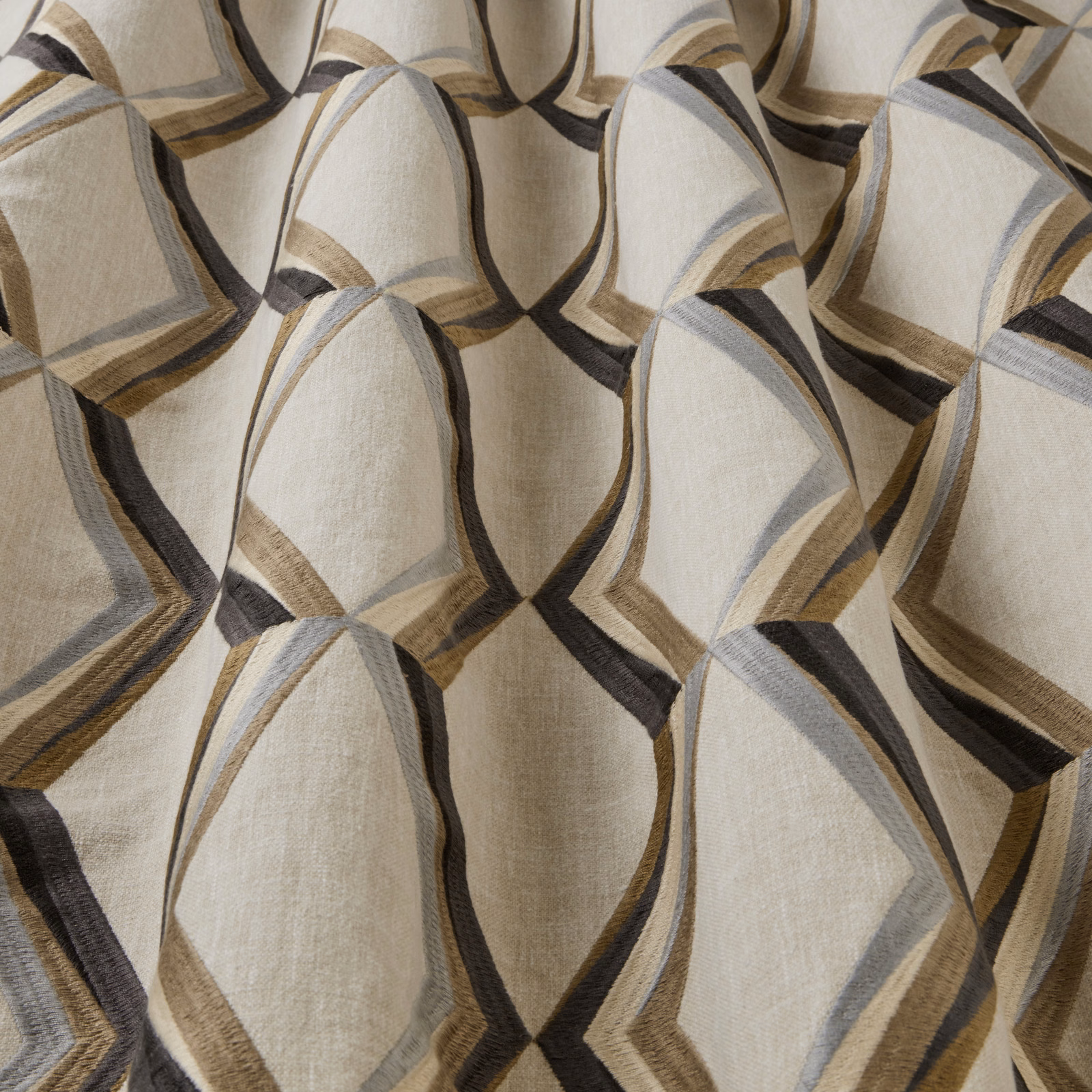Large geometric arc pattern in mineral beige, grey, taupe and black on woven fabric