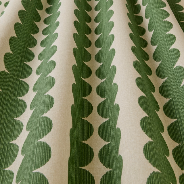 Cream fabric with vertical emerald green scalloped geometric stripes