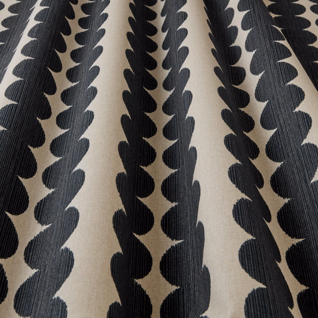 Cream fabric with bold black wavy vertical segments and subtle ribbed texture