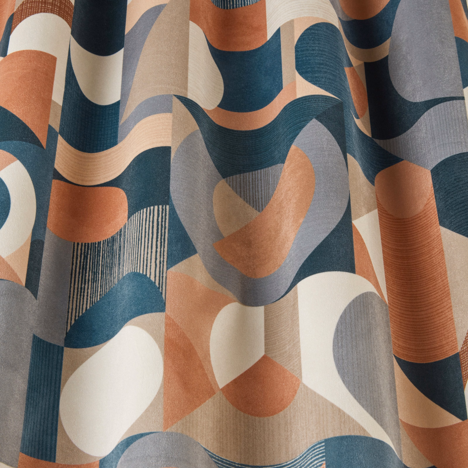 Abstract velvet fabric with terracotta, teal, grey and cream geometric waves