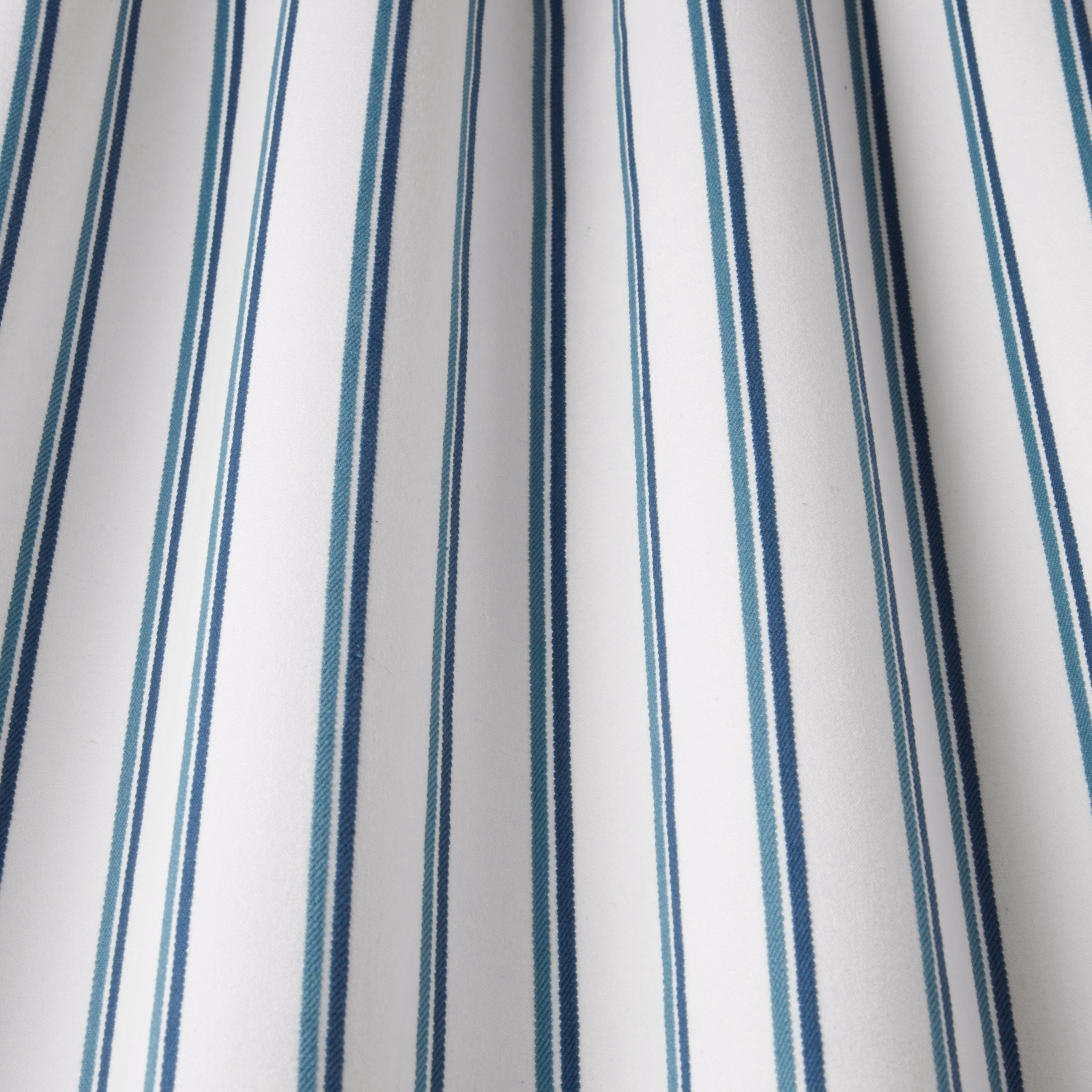 White cotton fabric with narrow teal and navy vertical stripes