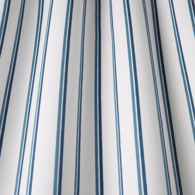 White cotton fabric with narrow teal and navy vertical stripes